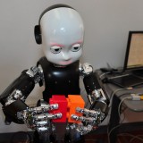 Robots on TV: AI goes back to baby basics